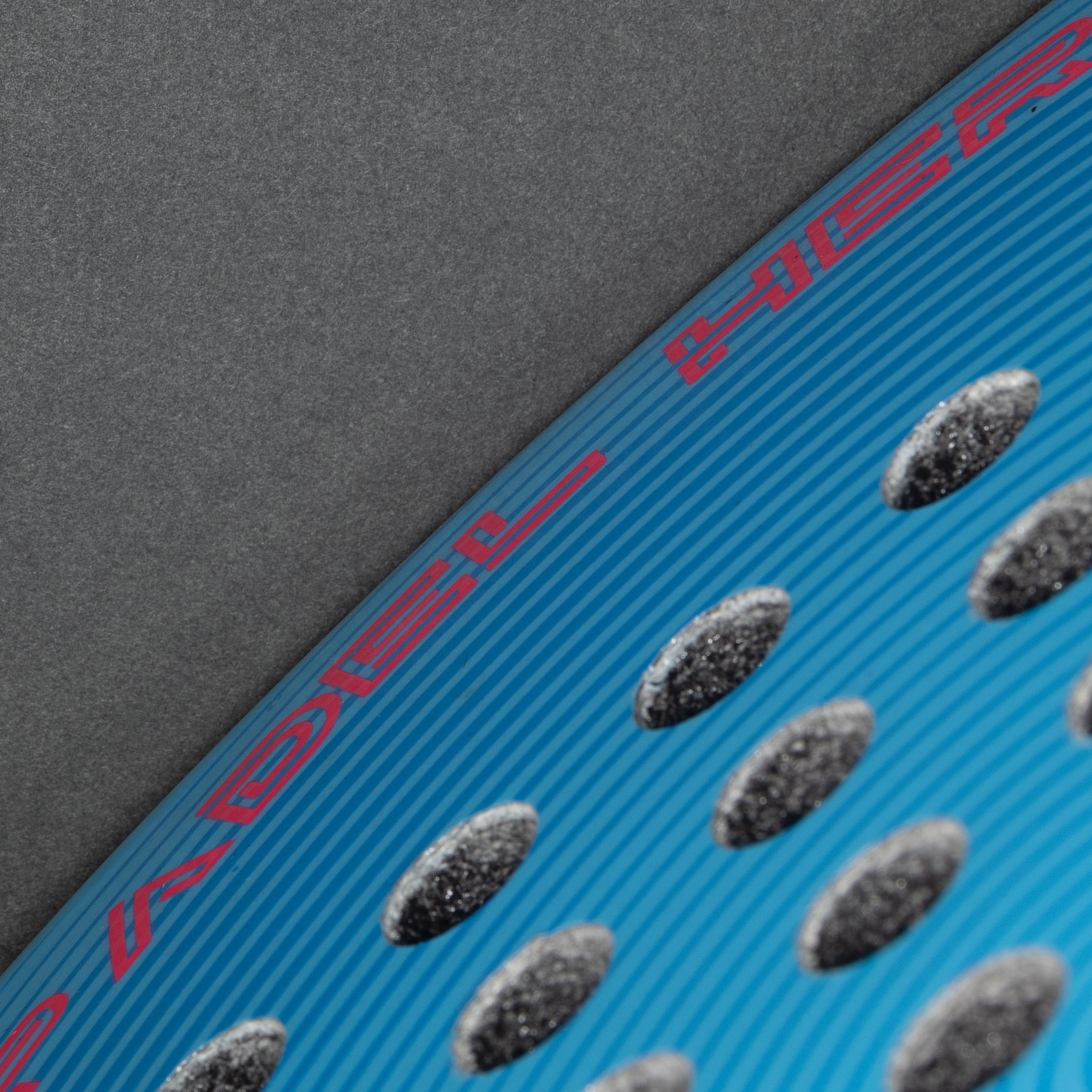 The Super Hero adult padel racket branding close-up